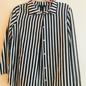 black & white striped blouse with soft sleeves.